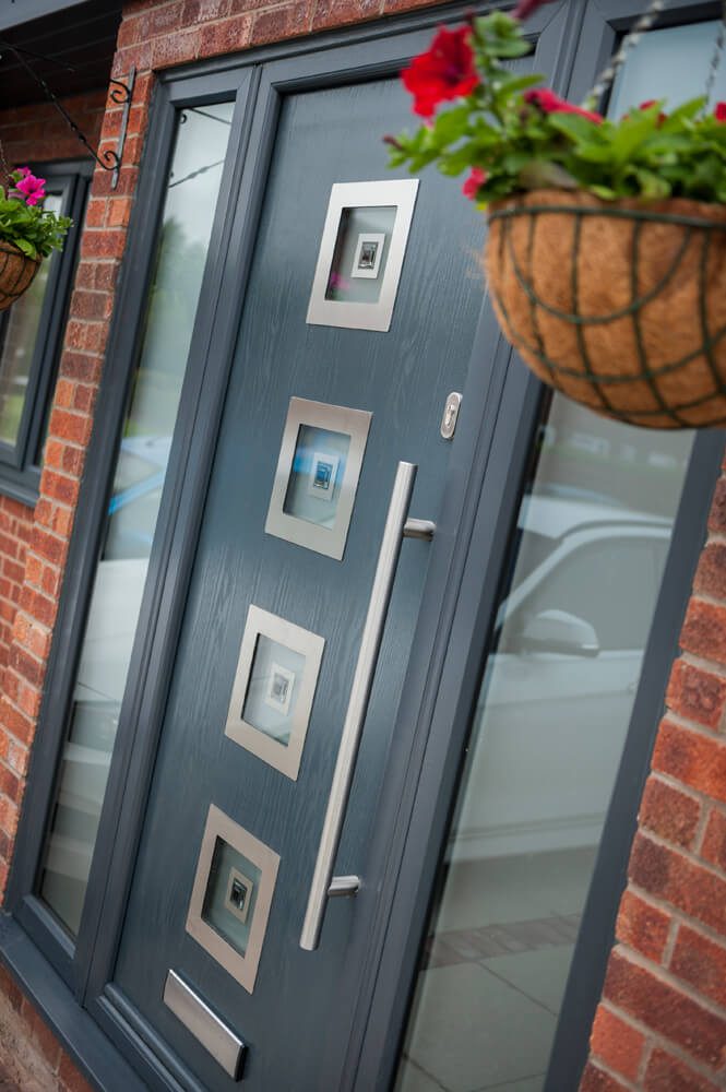 a beautiful black door with a silver square design at the front of it and 1 full glass side-by-side